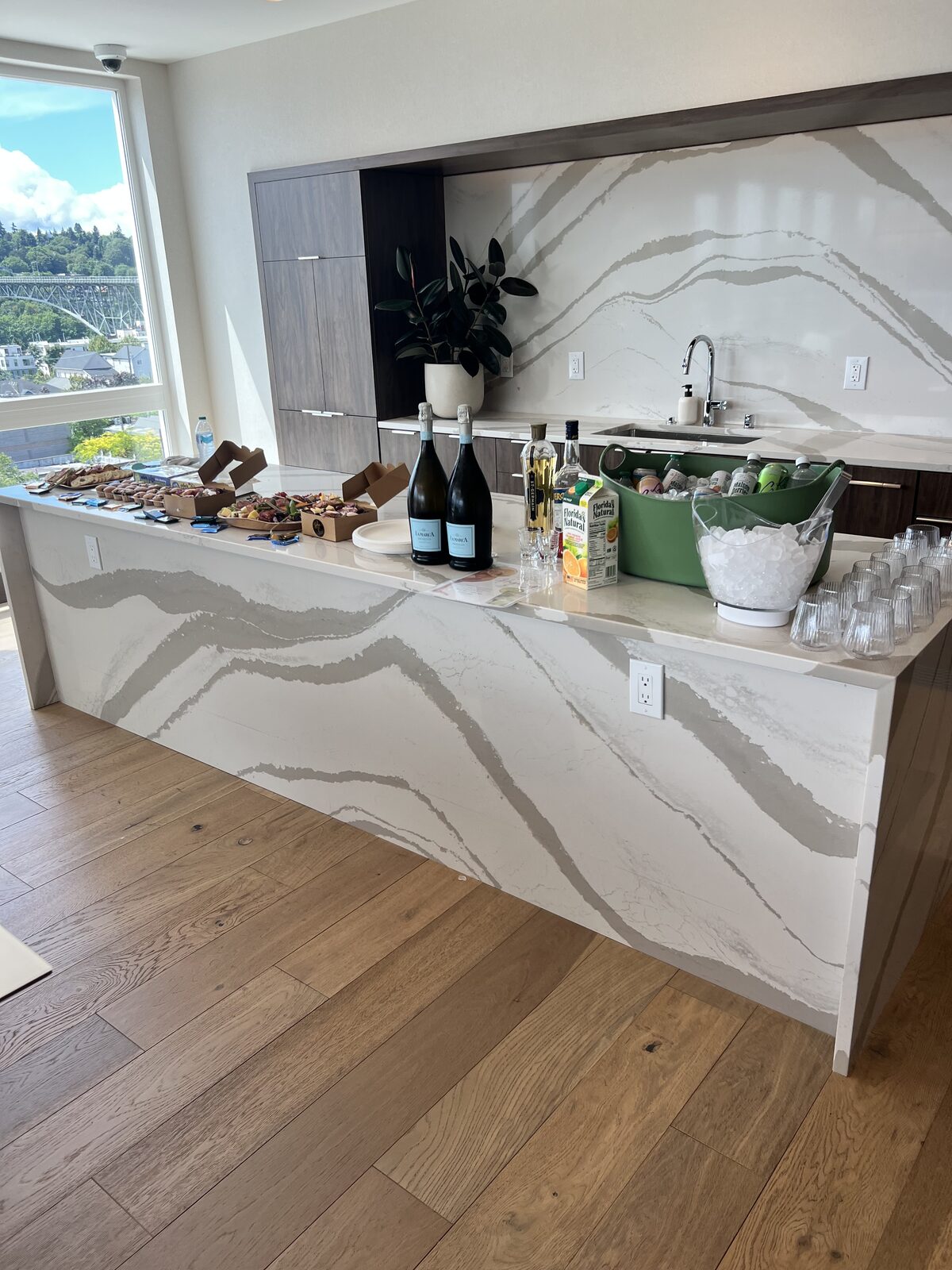 A long marble island laid with a generous spread of food